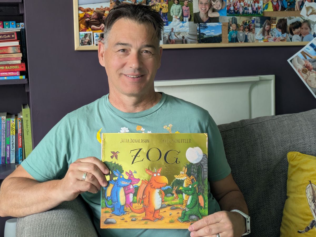 Grandpa holding the book Zog